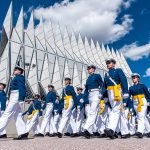 Air Force cadets marching with flags